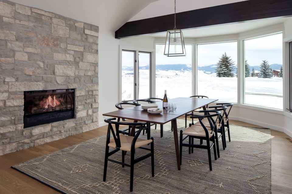 Dining area with fireplace and Sleeping Indian mountain views, can seat up to 12