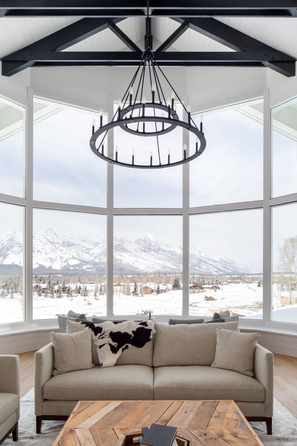 Lower level Great Room wall of windows framing the entire Teton range