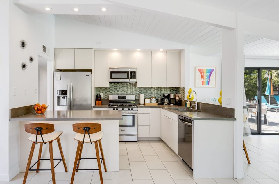 Open concept kitchen, complete with modern amenities and bar seating for 4.