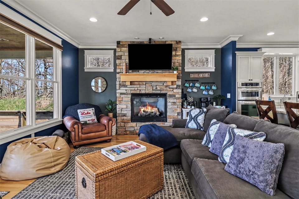 The living room features a comfortable full-size sleeper sofa, perfect for accommodating extra guests or enjoying a relaxing movie night. The fold-out bed sleeps two, and you'll find fresh sheets conveniently stored in the nearby kitchen pantry.