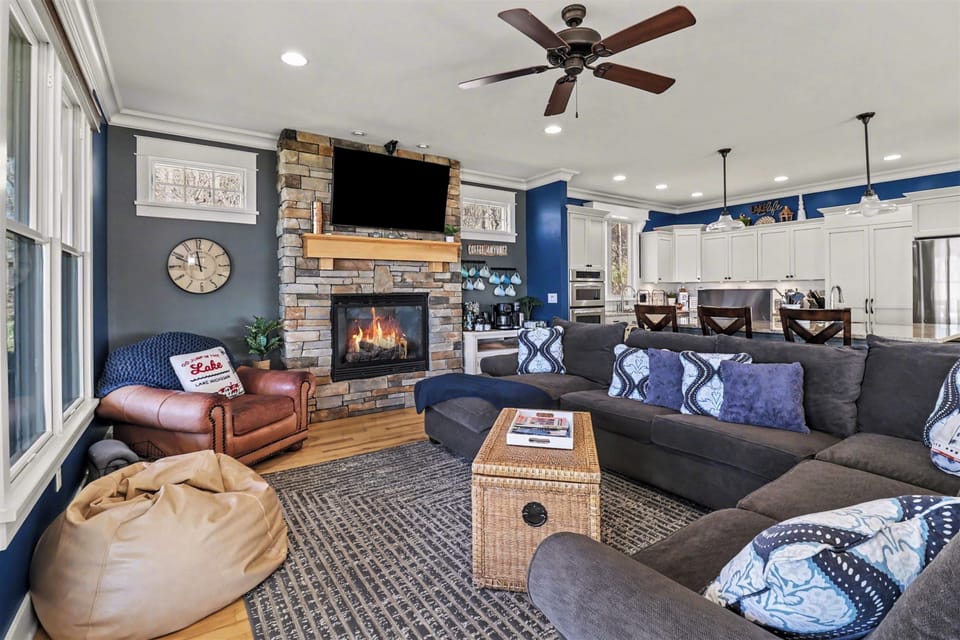 The living room features a comfortable full-size sleeper sofa, perfect for accommodating extra guests or enjoying a relaxing movie night. The fold-out bed sleeps two, and you'll find fresh sheets conveniently stored in the nearby kitchen pantry.