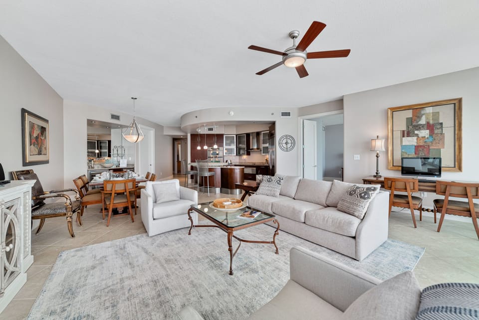 A light-filled living space with captivating views. This inviting room offers a perfect blend of comfort and style, creating a welcoming atmosphere for all.