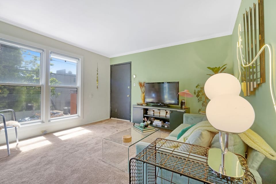 Cozy, velvet sofa and extra large windows. 