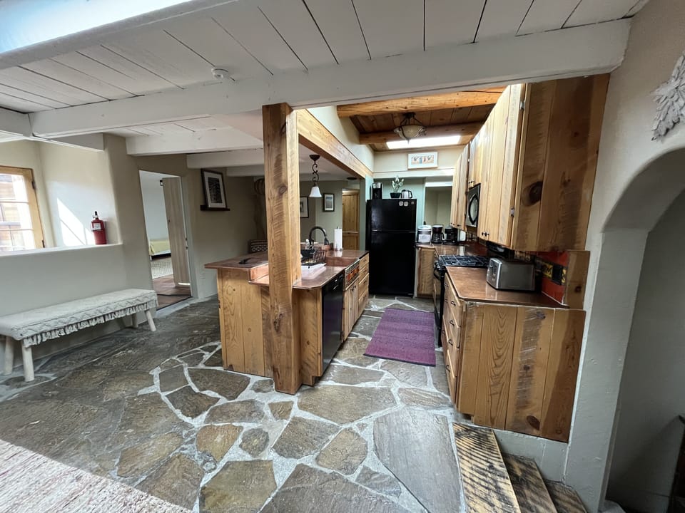 Kitchen fully equipped with gas stove, dishwasher, microwave, fridge