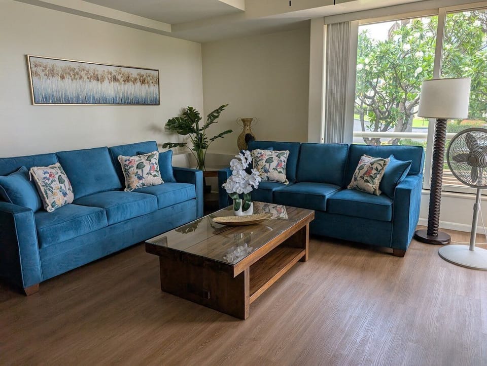 Bright living room with cozy sectional and natural light