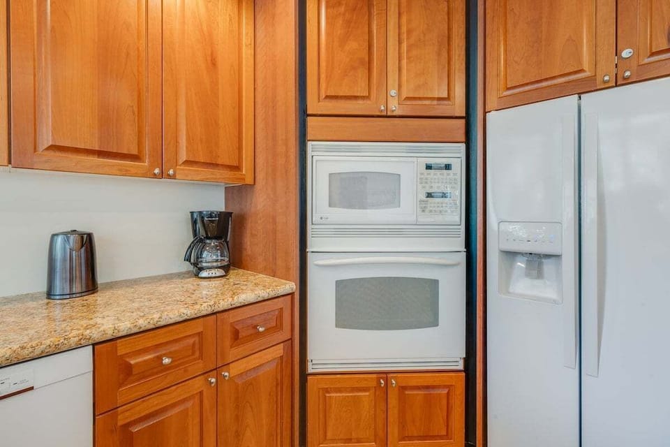 Bright kitchen view with modern appliances and coffee nook