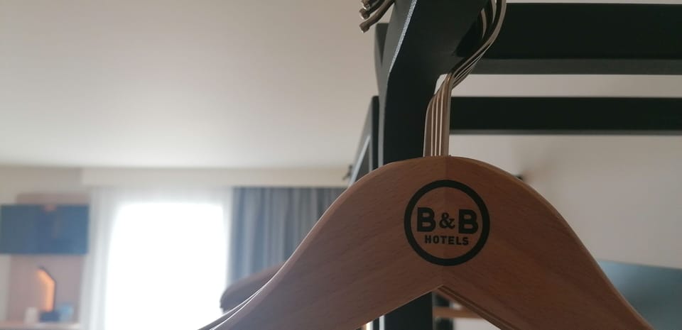 Premium bedding, desk, laptop workspace, blackout drapes