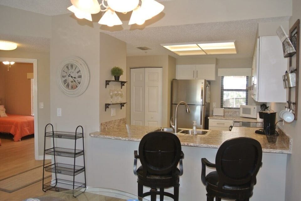 Condo, Multiple Beds, Kitchen, Partial Ocean View | Private kitchen | Fridge, microwave, oven, stovetop