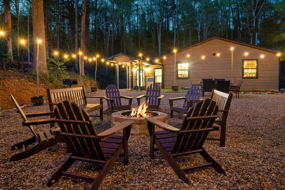 Private back yard with large fire pit, outdoor table, and games like corn hole!