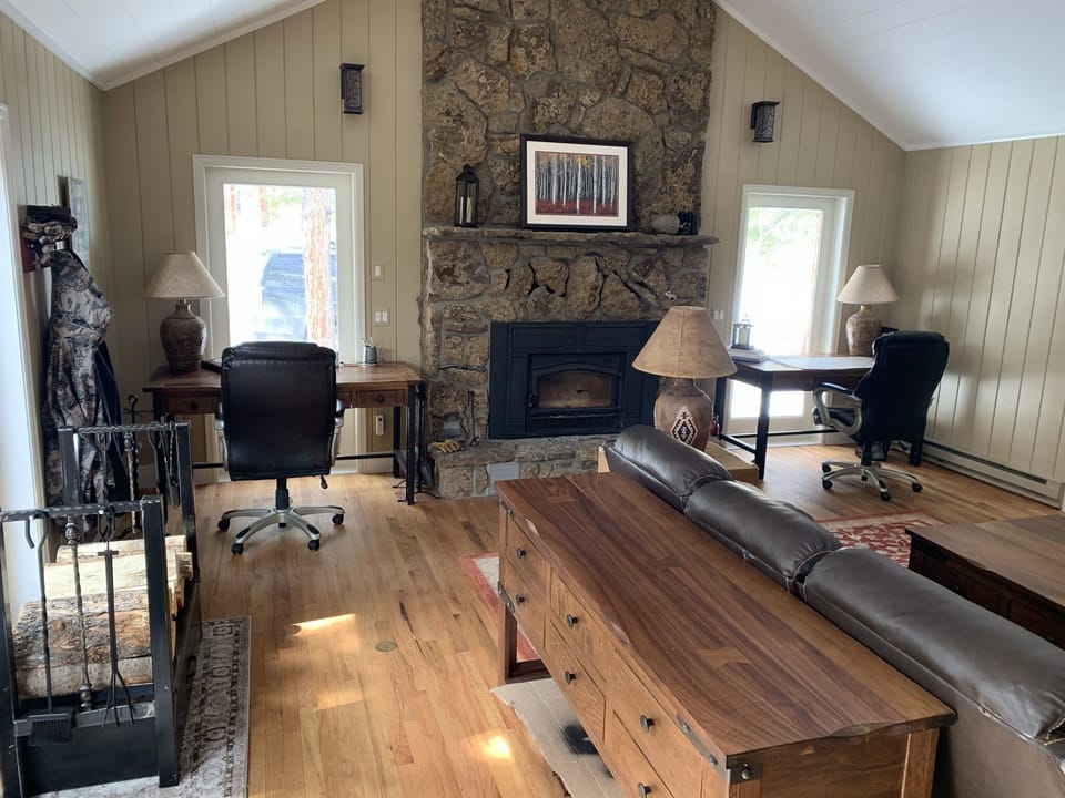 Upstairs Great room with wood insert and two flanking desk for remote working.
