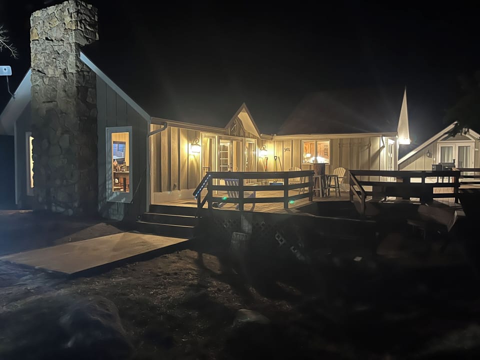 Front of house at night.
