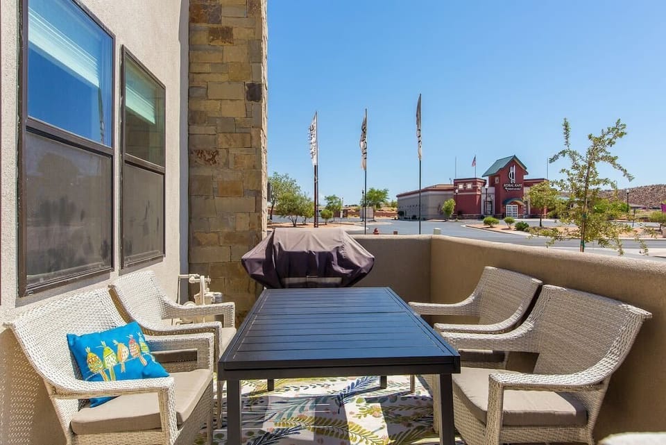 front patio with dining areas and 2 bbq's