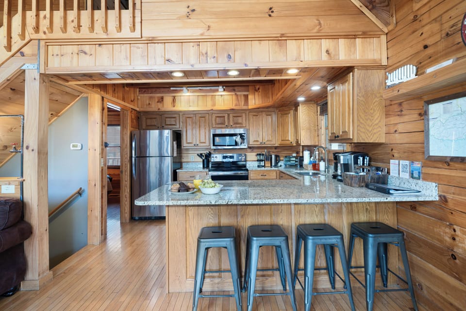 Well stocked kitchen & bar area that fits comfortably 4 people.