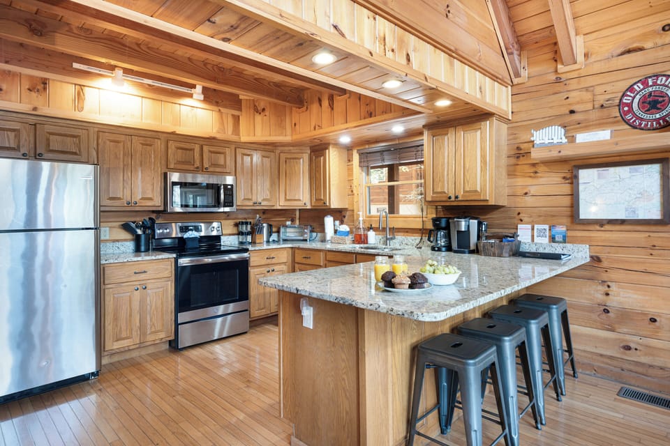 Well stocked kitchen & bar area that fits comfortably 4 people.