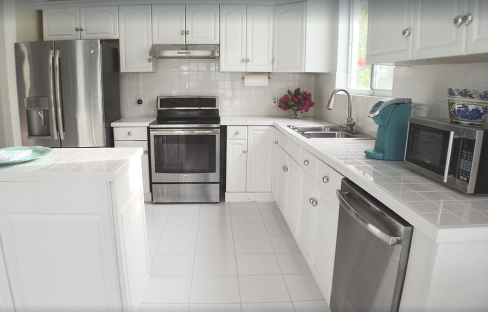 Bright, spacious kitchen with all stainless steel appliances and all utensils