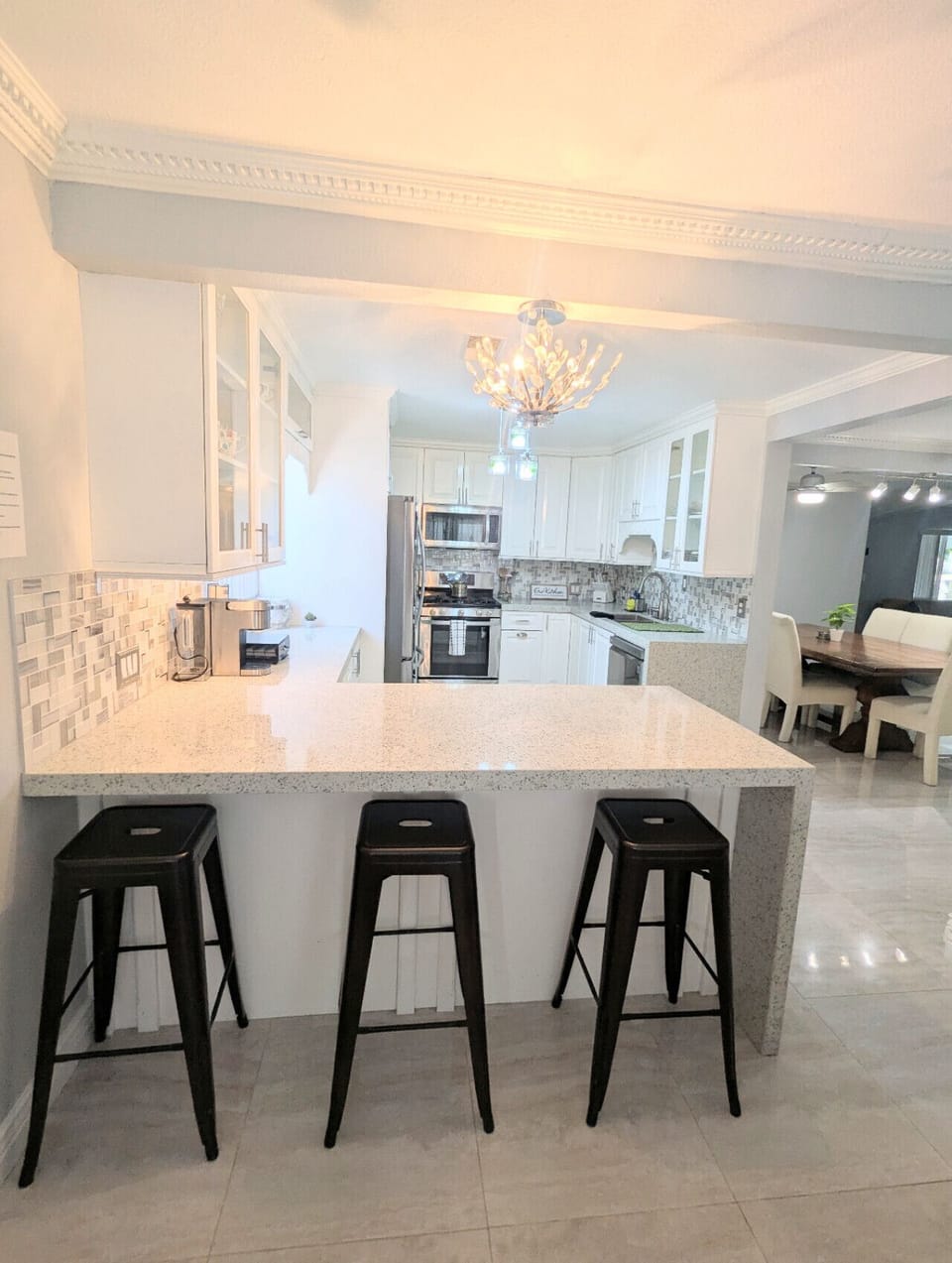 Bright and modern kitchen with bar seating