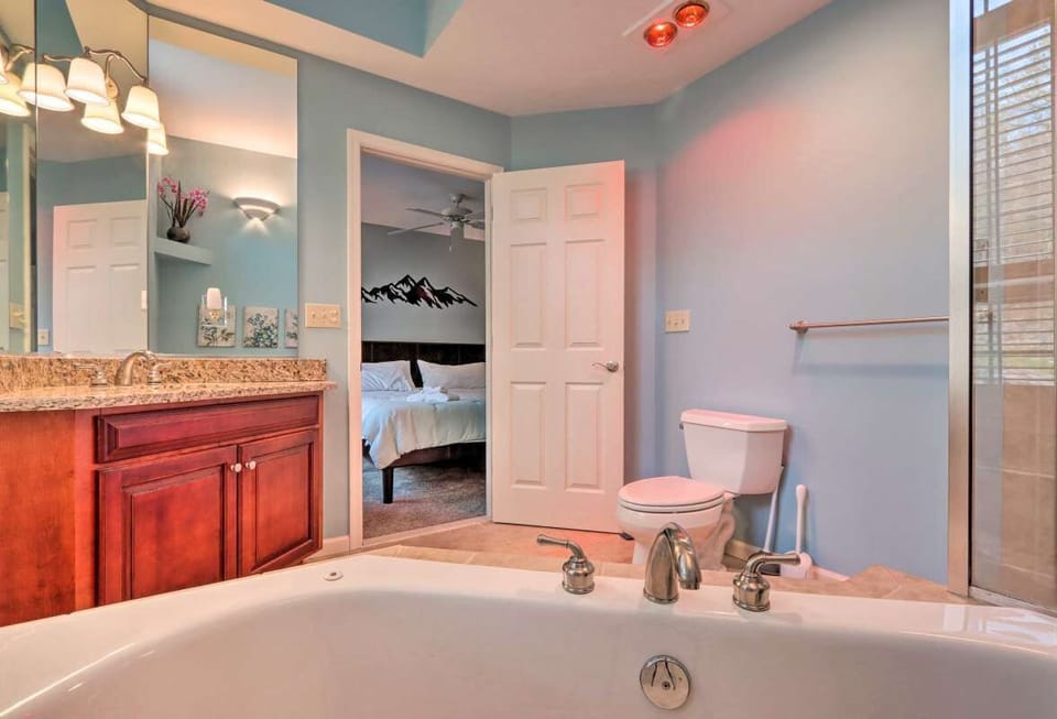Master bath is large and bright with high ceilings and separate shower 