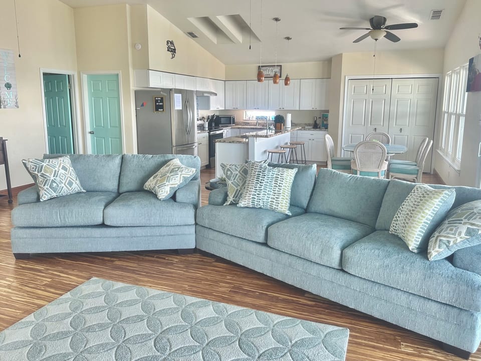 Family room open from kitchen with 55" TV, DVD player, books and games!