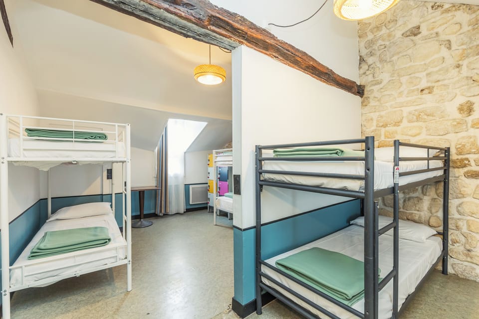 Bed in 6-Bed Dormitory Room, Shared Bathroom | Blackout drapes, iron/ironing board, free WiFi, bed sheets
