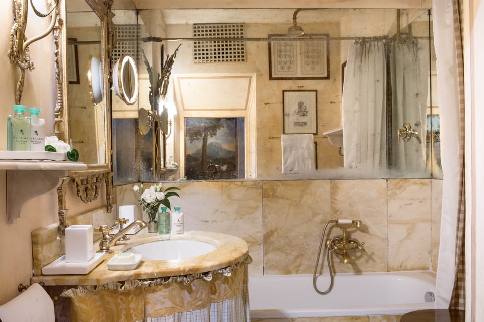 Napoleone Suite | Bathroom | Designer toiletries, hair dryer, bathrobes, slippers