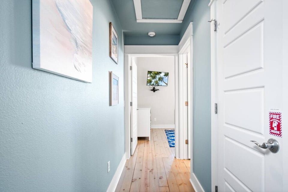 Bright Second-Floor Hallway Leading to Bedrooms