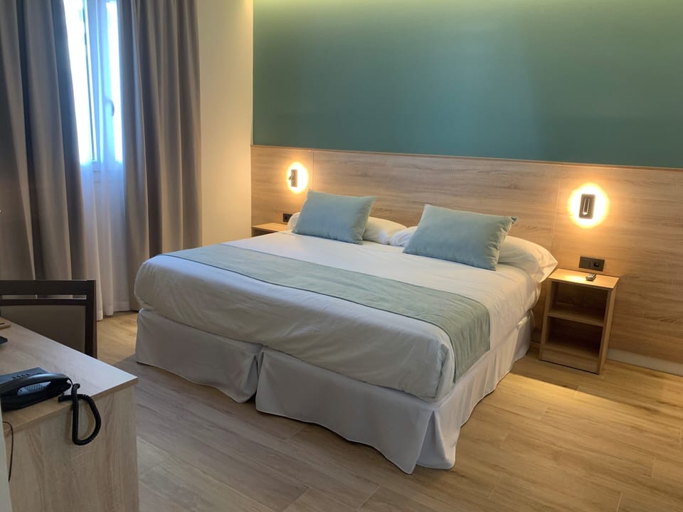 Superior Double or Twin Room | Down comforters, minibar, desk, blackout drapes