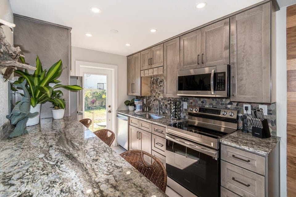 Modern kitchen with granite countertops and stainless steel appliances