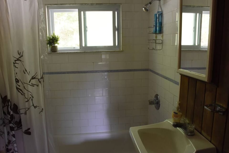 Bright, clean bathroom. Seating for one. :-)