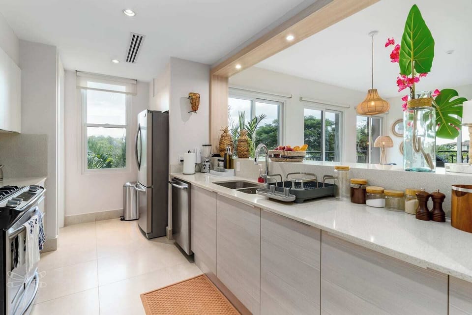 The light-filled kitchen is well-stocked with coffee and other basics.