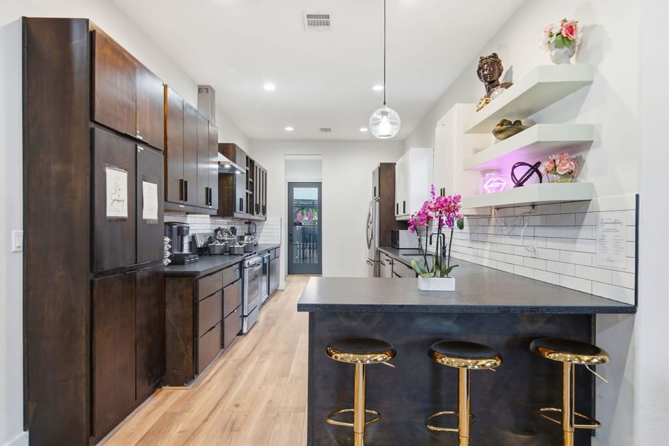 Modern gourmet kitchen with breakfast bar and stylish finishes