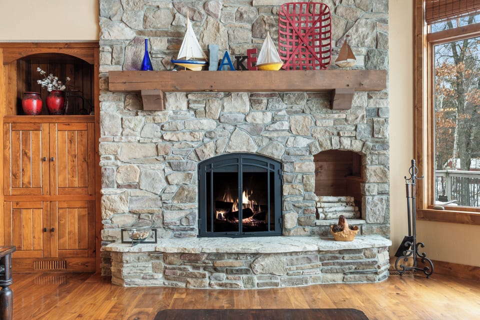 Gather around this stunning stone fireplace where crackling flames create the perfect ambiance for your cozy evening conversations.