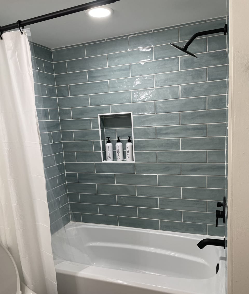 Hall bathroom with complementary shampoo, conditioner and body wash 