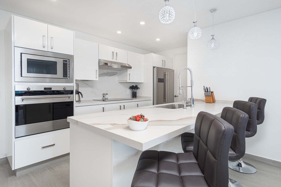 Sleek white countertop in the kitchen.
