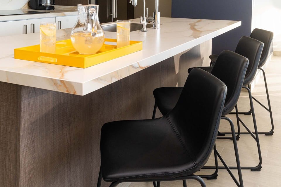 Stools line the kitchen Island