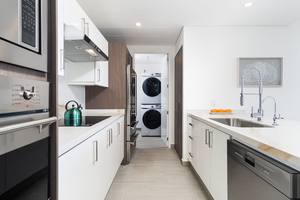 Off of the kitchen is a utility room with washer and dryer