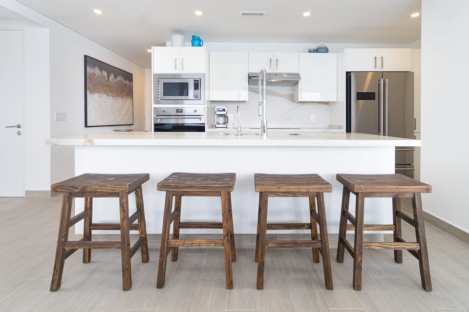 High bar stools at the kitchen island.