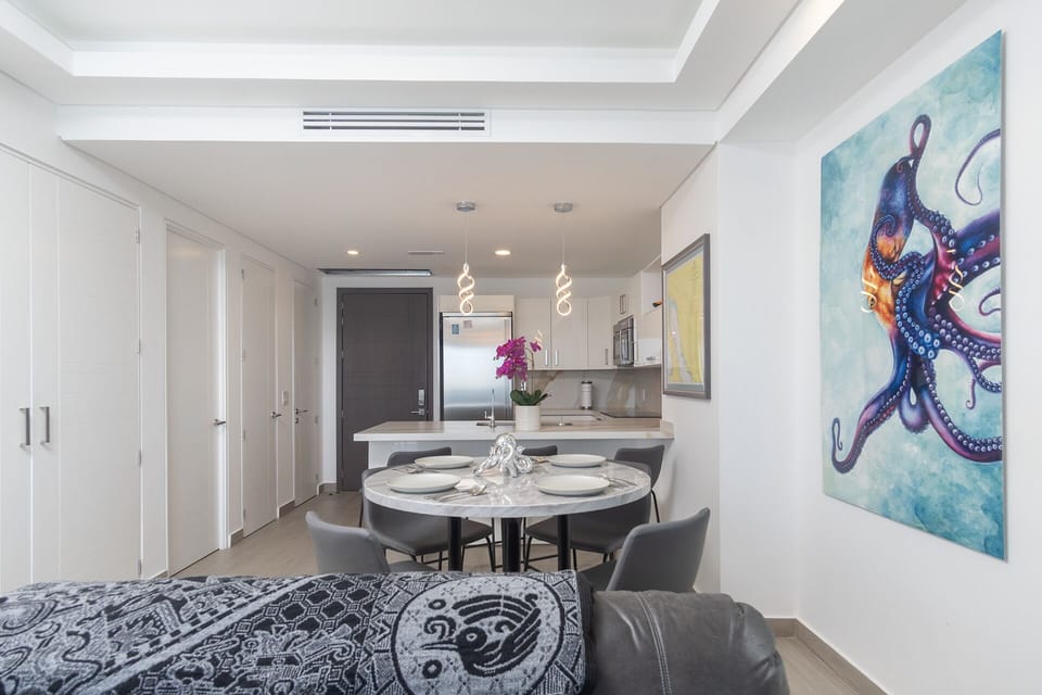 the dining table is near the kitchen