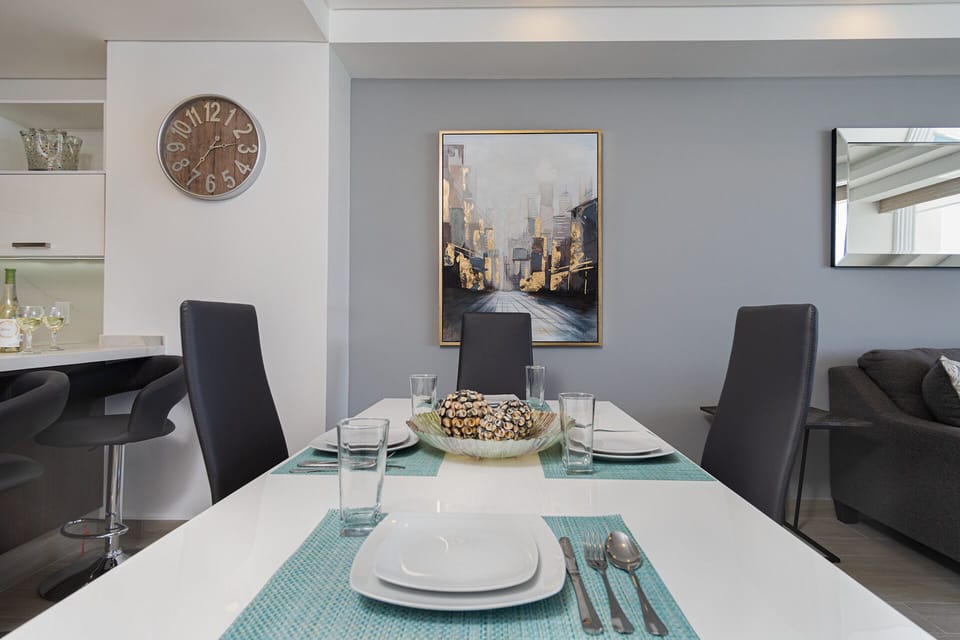 The dining table accommodates four.