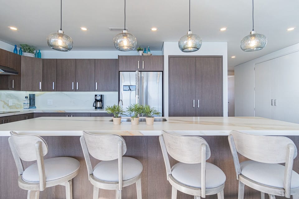 High back seats at the kitchen island make a great, casual gathering space.