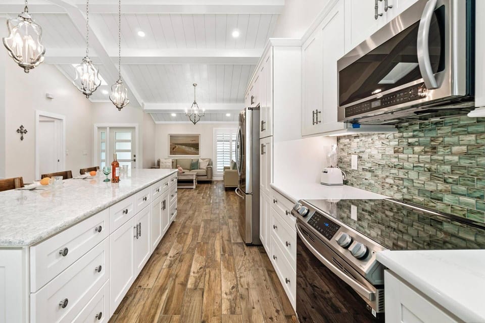 This kitchen boasts loads of storage space and gleaming appliances.
