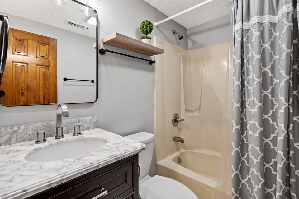 Walk-in shower and a wide vanity in the bathroom at Sedgefield 403, a 3-bedroom Cherry Grove rental