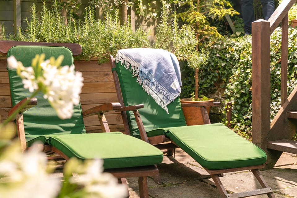 Private patio with dining area, sun loungers and bbq
