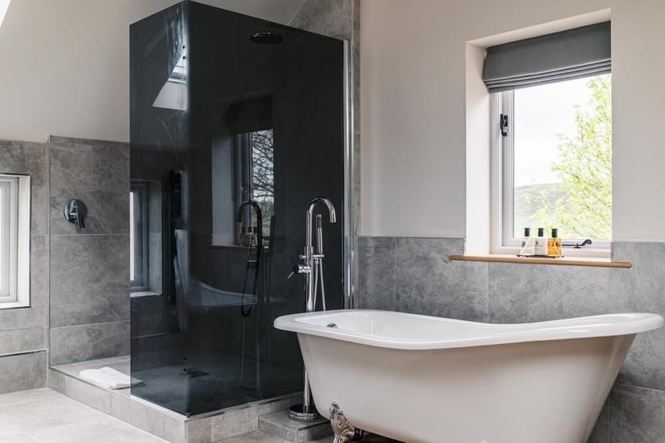 Double Room (Hampshire) | Bathroom | Deep soaking tub, rainfall showerhead, hair dryer, bathrobes