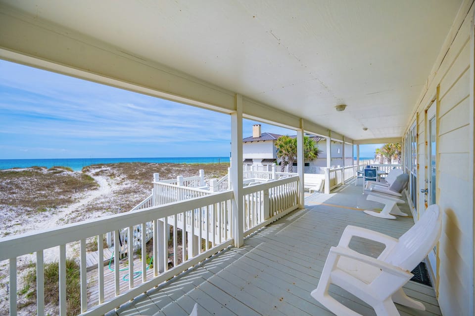 Chairs line the long porch where you soak in the endless horizon and the salt air breezes by