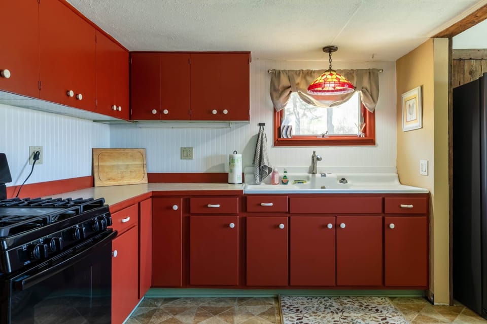 Kitchen- stocked with cookware, dinnerware, glassware