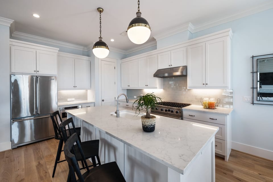 Kitchen features a large island with barstool seating for 4.
