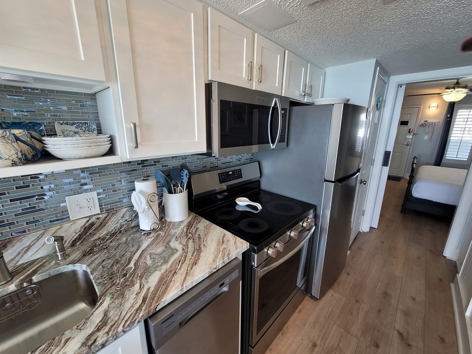 Compact kitchen space ideal for quick meals.