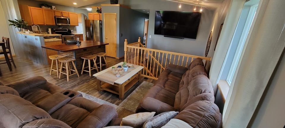 Main floor living & kitchen area layout w/island seating
