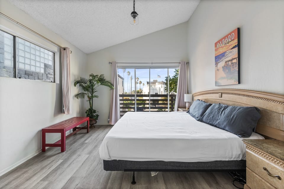 Spacious bedroom with natural light, king size memory foam bed