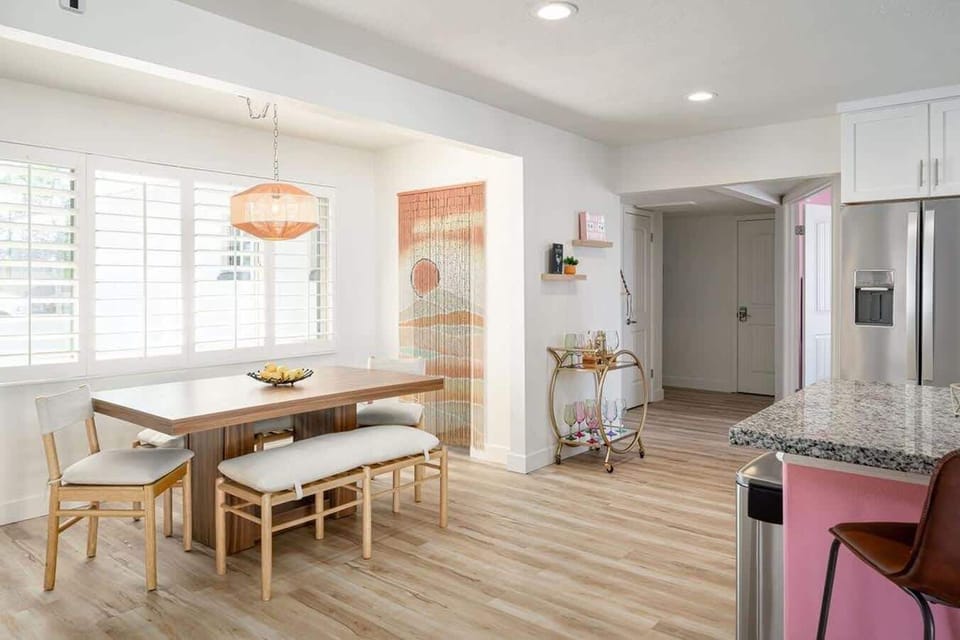 Modern and comfy dining room with pantry and beaded curtains add to the boho feel of the Pink Palms!